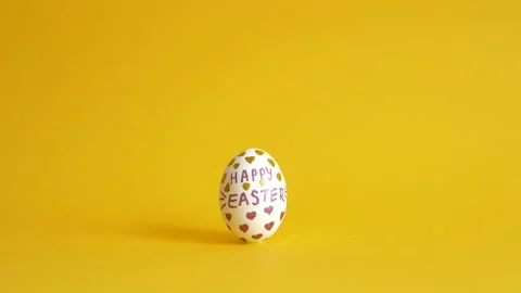 Unusual sets of Easter eggs on a yellow background Stock Footage 149959421