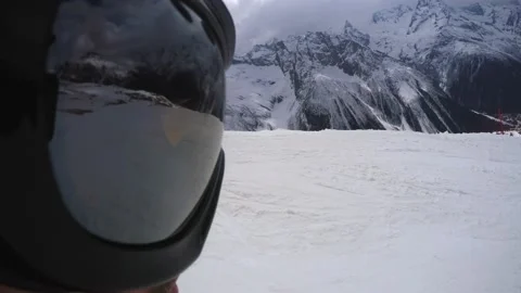 Unusual view from action camera aimed at mask going down slope and stops Stock Footage 138991326