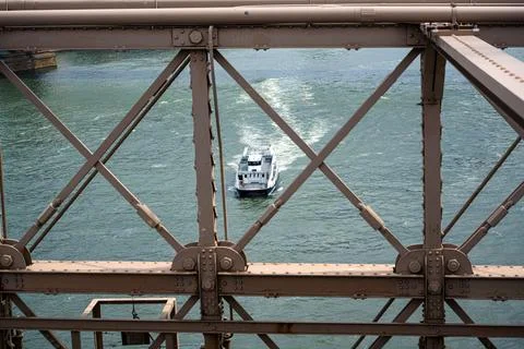 An unusual view through the railing of the Brooklyn Bridge Stock Photos