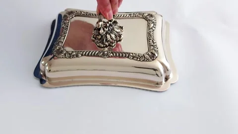 Unveiling Elegance: A Silver Lid Lifted in Timeless Grace Video stock 315739425