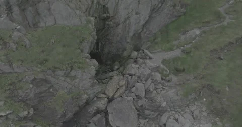 Unveiling Howth's Hidden Cave in a Dynamic Push-In Stock Footage 255519568