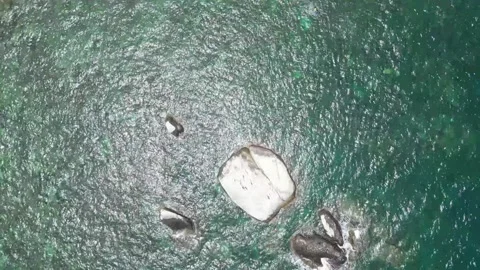 Unveiling Paradise: A Drone's View of a Pristine Beach - 4k RAW Stock Footage 266898251