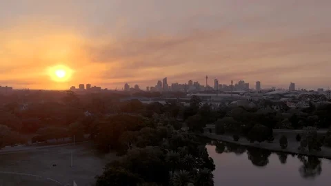 Unveiling shot of Sydney CBD at Sunset taken in Centennial Park, Australia, 4K Stock Footage