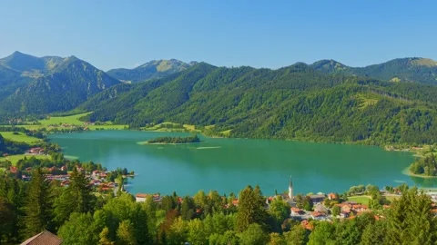 Unwind by the lake in Upper Bavaria with a view of peaceful Schliersee and it Stock Footage 308650747