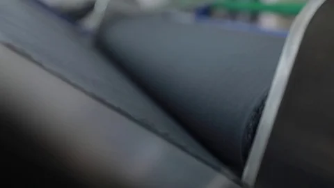 Unwind needed amount of textile on the factory closeup Stock-Footage 82896790