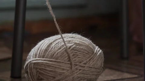 Unwinding a ball of thread. Stock Footage 169984847