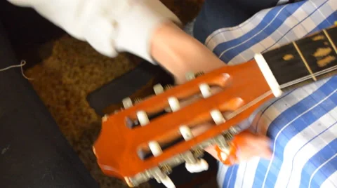 Unwinding String On Spanish Guitar Stock Footage 67977839