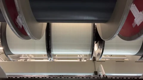 The unwinding of the threads from the bobbin of the warp Stock Footage 265861067
