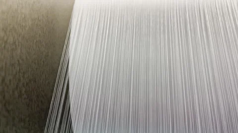 The unwinding of the threads from the bobbin of the warp Stock Footage 267446649