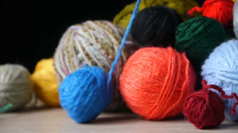 Unwinds A  Ball Of Blue Yarn Stock Footage 65442912