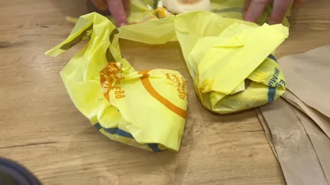 Unwrapped chicken biscuit sandwich on wrapper Stock Footage 321691923