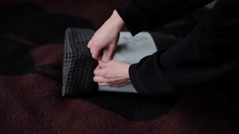 Unwrapping the bedspread Video stock 233513002