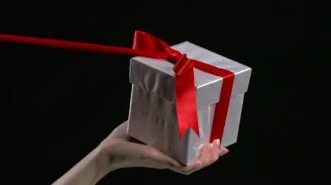 Unwrapping gift box, Slow Motion Stock Footage 9296165