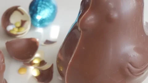 Unwrapping Joy: Delightful Easter Chocolate Eggs Celebration Stock Footage 332944368