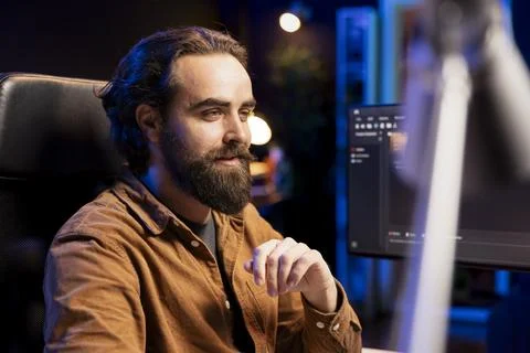 Upbeat developer content with installed fortified code preventing cyberattacks Stock Photos