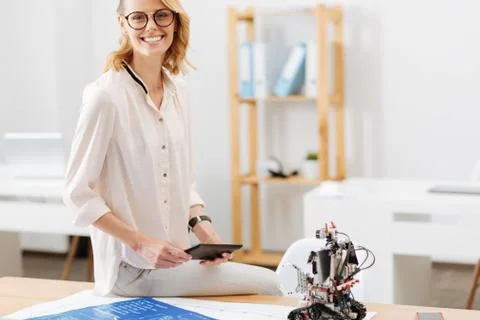 Upbeat engineer testing innovative devices in the office Foto stock