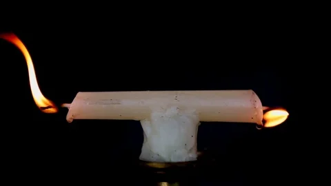 Upclose Candle Burning At Both Ends Stock Footage 81196961