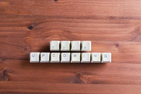 Upcoming New year 2018 on computer keyboard keys buttons on wooden background Foto stock