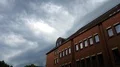 Upcoming thunderstorm clouds over roofs in Brunswick city GER 4k or 4k+ Resolution