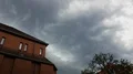 Upcoming thunderstorm clouds panning over roofs in Brunswick city GER 4k or 4k+ Resolution