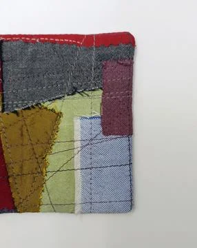 Upcycled fabric patchwork coaster close-up Stock Photos