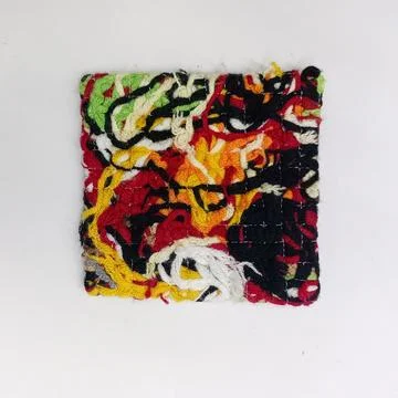Upcycled Textile Coaster Created from Scrap Yarn. Stock Photos