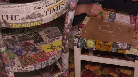 Upcycling - Creative reusing old Chairs sticking Press Clippings and Beer Labels Video stock 75520078