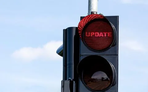 UPDATE Concept. Traffic Light with red light Stock Photos