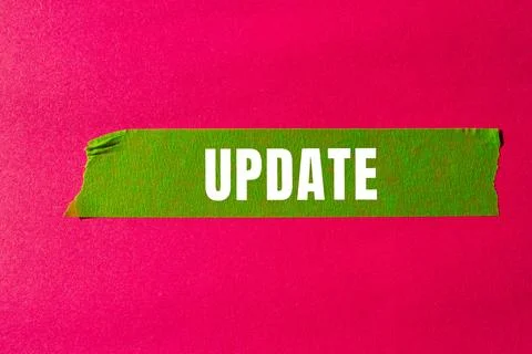 Update message written on ripped torn paper background. Conceptual Update s.. Stock Photos