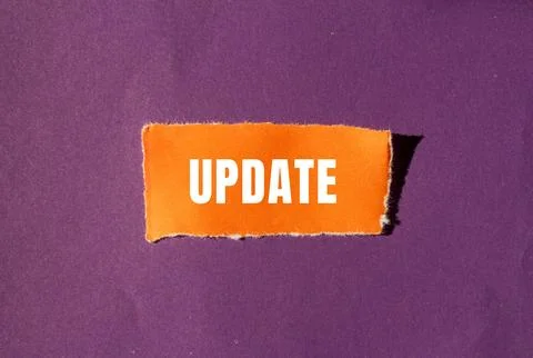 Update message written on ripped torn paper background. Conceptual Update s.. Stock Photos