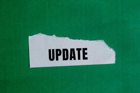 Update message written on ripped torn paper background. Conceptual Update s.. Stock Photos