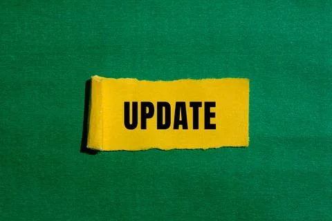 Update message written on ripped torn paper background. Conceptual Update s.. Stock Photos