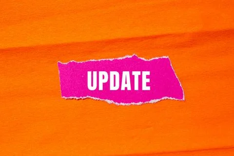 Update message written on ripped torn paper background. Conceptual Update s.. Stock Photos