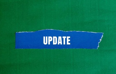 Update message written on ripped torn paper background. Conceptual Update s.. Stock Photos