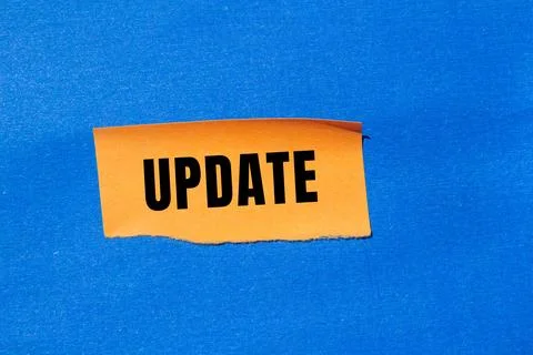 Update message written on ripped torn paper background. Conceptual Update s.. Stock Photos