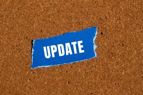 Update message written on ripped torn paper background. Conceptual Update s.. Stock Photos