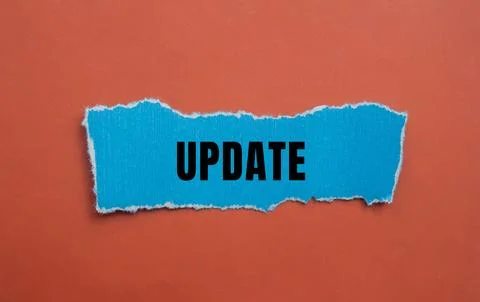 Update message written on ripped torn paper background. Conceptual Update s.. Stock Photos