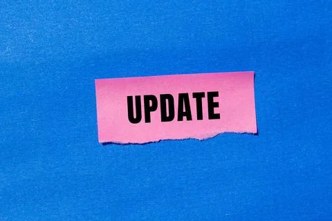 Update message written on ripped torn paper background. Conceptual Update s.. Stock Photos