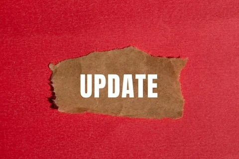 Update message written on ripped torn paper background. Conceptual Update s.. Stock Photos
