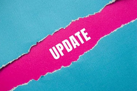 Update message written on ripped torn paper background. Conceptual Update s.. Stock Photos