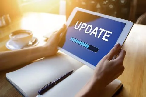 Update status bar on device screen. Software development and technology concept. Stock Photos