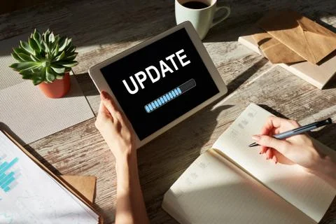 Update status bar on device screen. Software development and technology concept. Stock Photos
