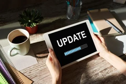 Update status bar on device screen. Software development and technology concept. Stock Photos