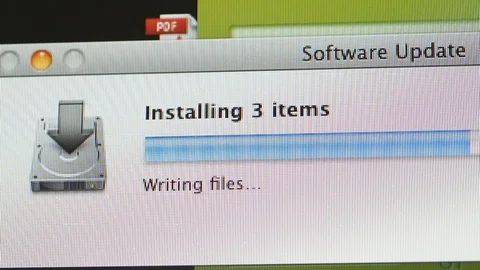 Updates software on Apple iMac computer Stock Footage 99138394