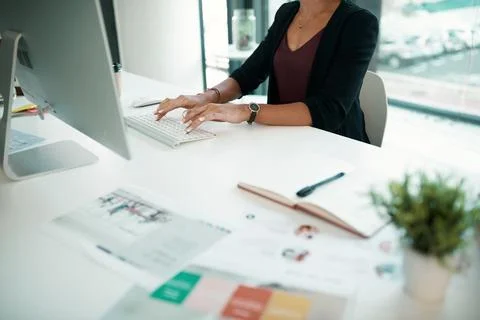 Updating all the files on the system. an unrecognizable businesswoman sitting Stock Photos