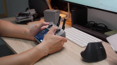 Updating DJI Mini 5 Pro firmware at studio workspace on September 5 2026 스톡 동영상 344617857