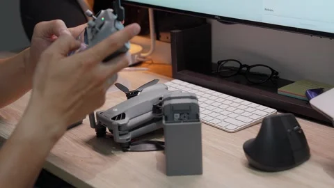 Updating DJI Mini 5 Pro firmware at studio workspace on September 5 2026 스톡 동영상 344617882