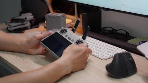 Updating DJI Mini 5 Pro firmware at studio workspace on September 5 2026 스톡 동영상 344617983