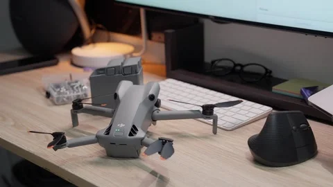 Updating DJI Mini 5 Pro firmware at studio workspace on September 5 2026 스톡 동영상 344619444