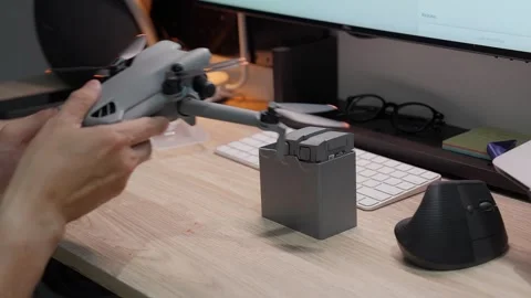 Updating DJI Mini 5 Pro firmware at studio workspace on September 5 2026 스톡 동영상 344619451